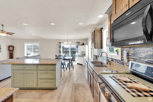5295 S 4425 W, Hooper, UT 84315 - kitchen featuring black microwave, white range with gas cooktop, backsplash, light wood-type flooring, and recessed lighting