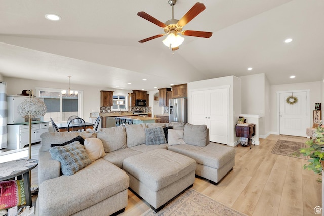 5295 S 4425 W, Hooper, UT 84315 - living room featuring light wood-type flooring, lofted ceiling, ceiling fan, a chandelier, and recessed lighting