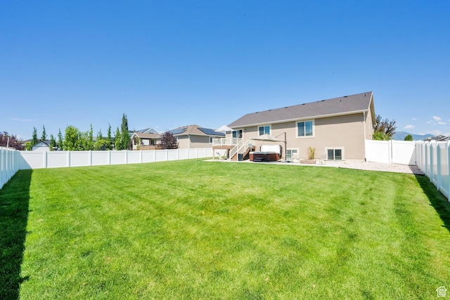 5295 S 4425 W, Hooper, UT 84315 - back of house featuring a fenced backyard, stucco siding, and stairway