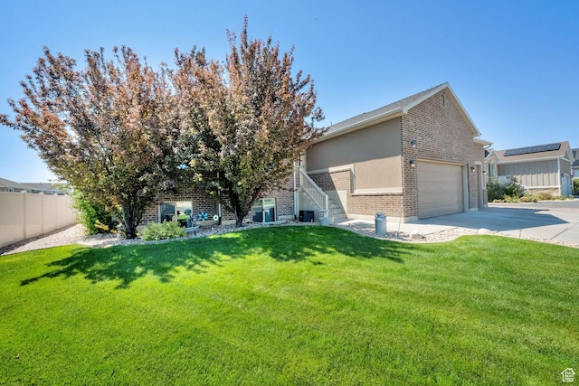 5295 S 4425 W, Hooper, UT 84315 - view of front of property with brick siding, a garage, and driveway
