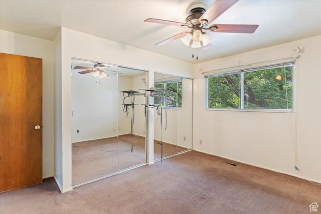 457 E 1750 N, North Ogden, UT 84414 - unfurnished bedroom featuring multiple closets, carpet, and a ceiling fan