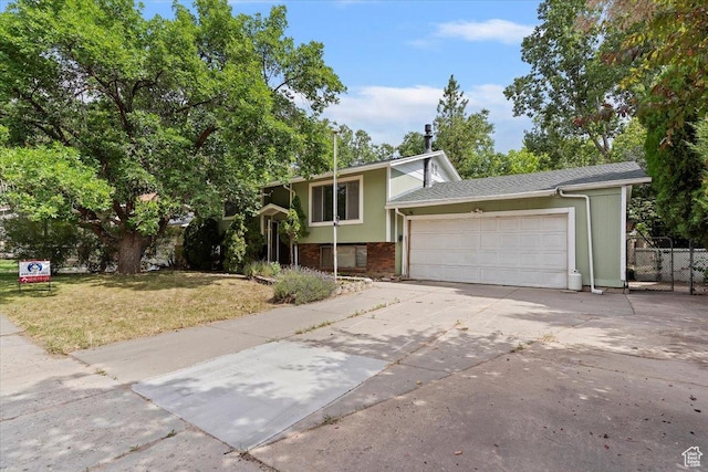 457 E 1750 N, North Ogden, UT 84414 - view of front facade featuring a garage, concrete driveway, and brick siding