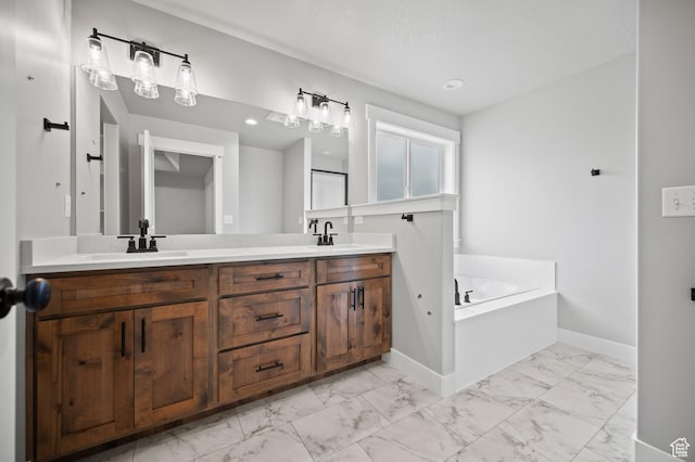 9420 N 5600, Elwood, UT 84337 - full bathroom with marble finish floors, double vanity, a garden tub, and recessed lighting