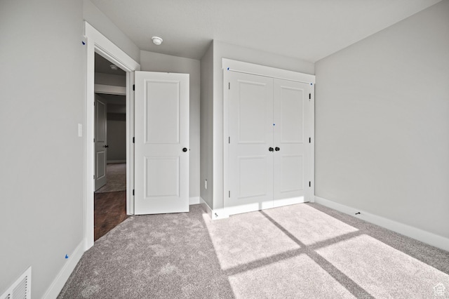 9420 N 5600, Elwood, UT 84337 - unfurnished bedroom featuring carpet flooring and a closet