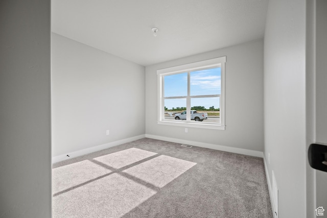 9420 N 5600, Elwood, UT 84337 - spare room with carpet and baseboards
