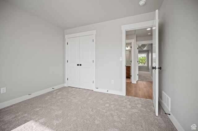 9420 N 5600, Elwood, UT 84337 - unfurnished bedroom featuring carpet flooring and a closet