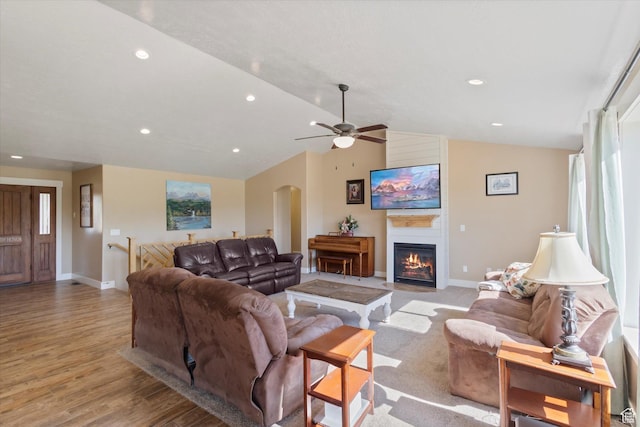 775 N 500 E, Spring City, UT 84662 - living room with arched walkways, a ceiling fan, lofted ceiling, light wood-style flooring, and a fireplace