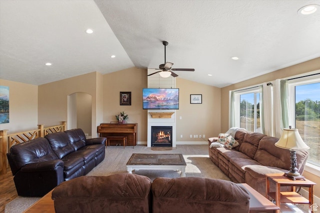 775 N 500 E, Spring City, UT 84662 - living area with a ceiling fan, lofted ceiling, a fireplace with flush hearth, recessed lighting, and arched walkways