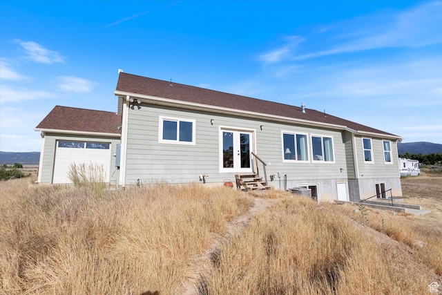 775 N 500 E, Spring City, UT 84662 - back of property featuring french doors, entry steps, a garage, a mountain view, and a shingled roof
