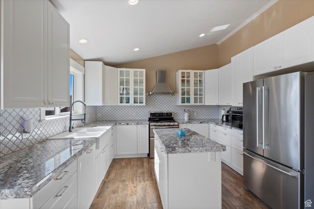 775 N 500 E, Spring City, UT 84662 - kitchen with stainless steel appliances, wall chimney range hood, lofted ceiling, a kitchen island, and light stone counters