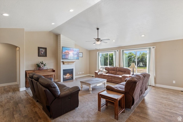 775 N 500 E, Spring City, UT 84662 - living room featuring hardwood / wood-style floors, arched walkways, ceiling fan, a large fireplace, and vaulted ceiling