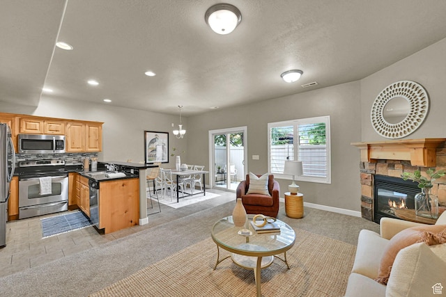 1028 W 950 N, Layton, UT 84041 - living area with recessed lighting and a stone fireplace