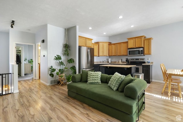 14861 S Treseder St, Draper, UT 84020 - living room with light wood-style floors and recessed lighting