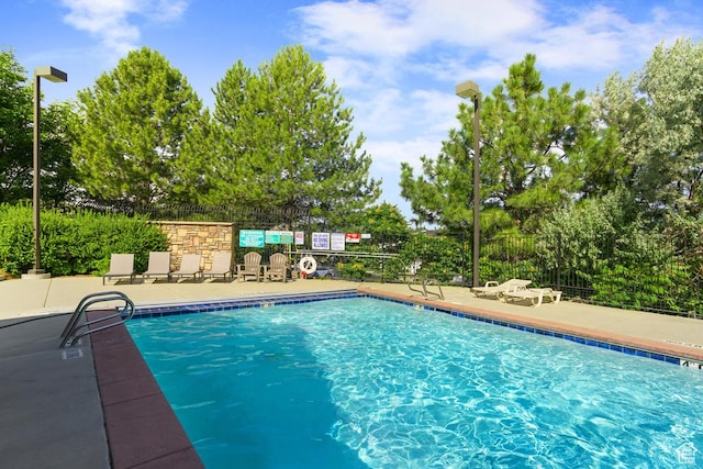 14861 S Treseder St, Draper, UT 84020 - community pool with a patio and view of scattered trees