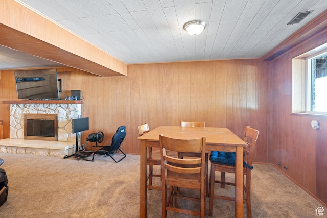 1851 N Main St, Centerville, UT 84014 - carpeted dining room featuring wooden walls and a stone fireplace