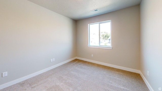 7497 W Sage Slope Way, Herriman, UT 84096 - unfurnished room with light carpet and a textured ceiling