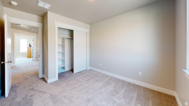 7497 W Sage Slope Way, Herriman, UT 84096 - unfurnished bedroom with light carpet and a closet