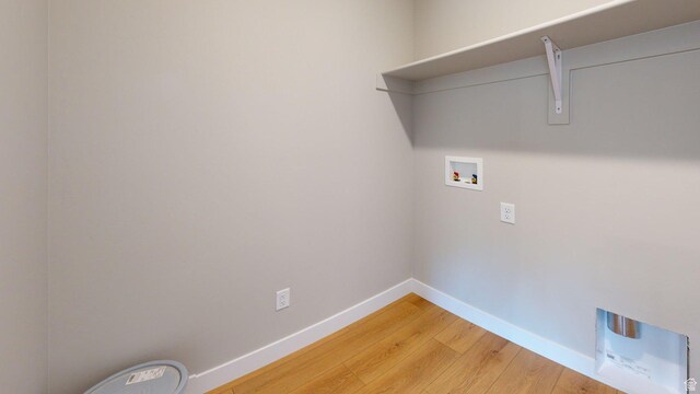 7497 W Sage Slope Way, Herriman, UT 84096 - washroom featuring hookup for a washing machine and light wood finished floors