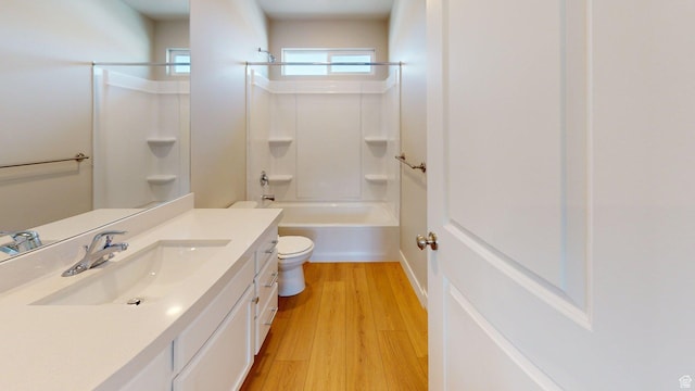 7497 W Sage Slope Way, Herriman, UT 84096 - bathroom with vanity, wood finished floors, and tub / shower combination