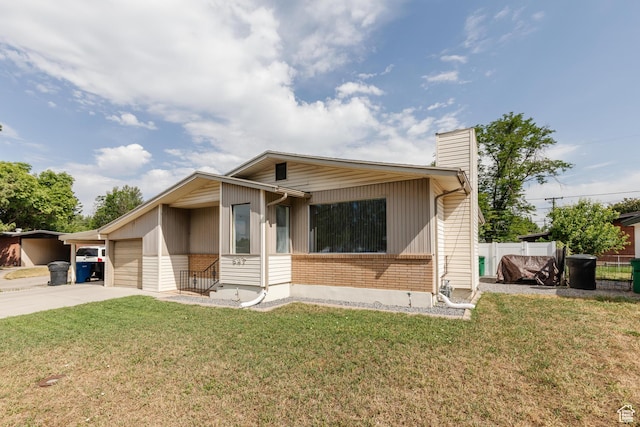 547 E 170 S, Logan, UT 84321 - view of front of property with brick siding, concrete driveway, a chimney, and an attached garage