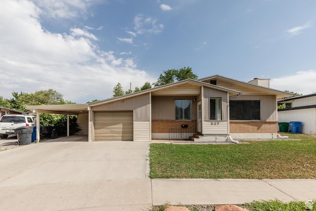 547 E 170 S, Logan, UT 84321 - view of front of property featuring brick siding, concrete driveway, a front yard, entry steps, and a chimney