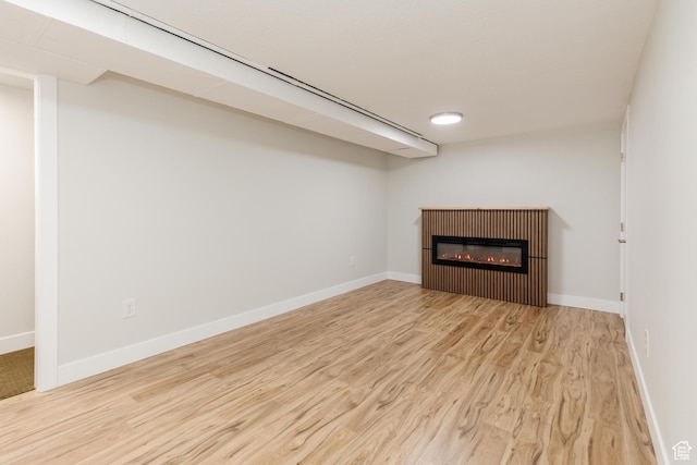 547 E 170 S, Logan, UT 84321 - unfurnished living room with wood finished floors and a glass covered fireplace