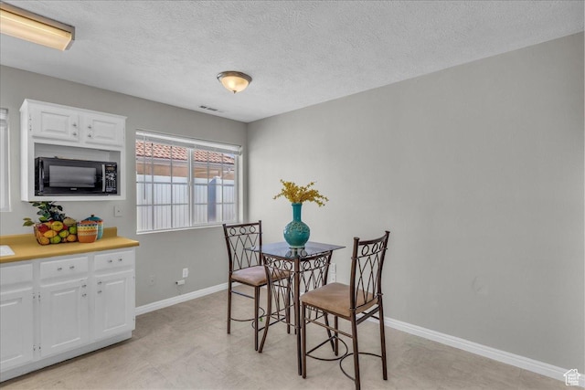 1360 E Telegraph Unit 14, Washington, UT 84780 - dining space with baseboards and a textured ceiling