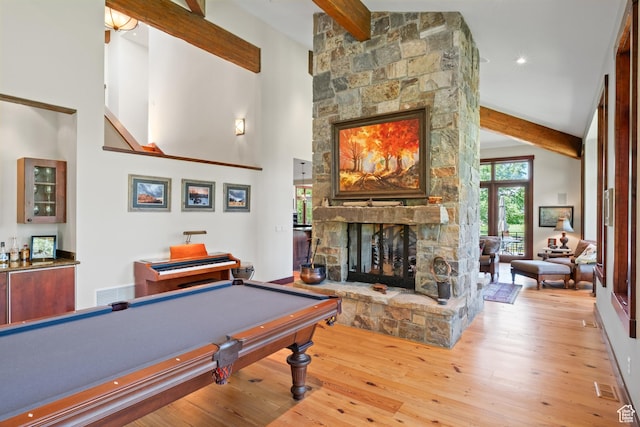 4445 N Millrace Rd, Oakley, UT 84055 - recreation room with a stone fireplace, beamed ceiling, wood finished floors, pool table, and bar area