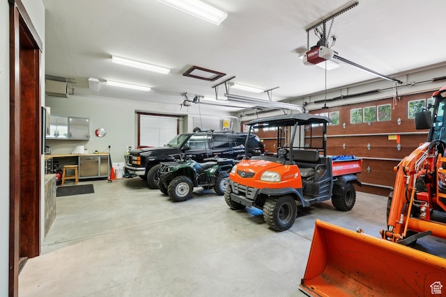 4445 N Millrace Rd, Oakley, UT 84055 - garage featuring a garage door opener
