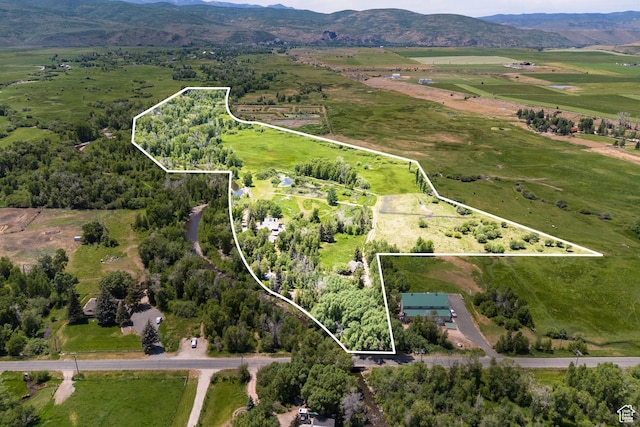4445 N Millrace Rd, Oakley, UT 84055 - aerial view of sparsely populated area with property boundaries highlighted and a mountain backdrop