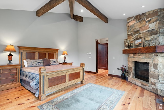 4445 N Millrace Rd, Oakley, UT 84055 - bedroom with a stone fireplace, beam ceiling, wood finished floors, and high vaulted ceiling