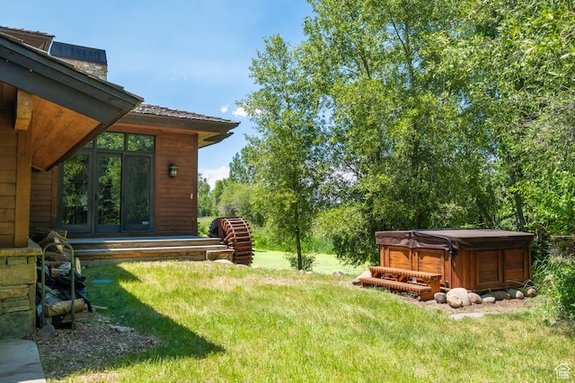 4445 N Millrace Rd, Oakley, UT 84055 - view of green lawn with a hot tub and french doors