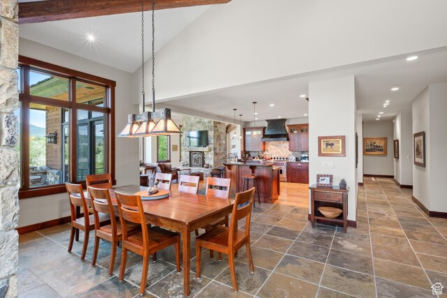 4445 N Millrace Rd, Oakley, UT 84055 - dining space featuring stone tile floors, recessed lighting, and high vaulted ceiling