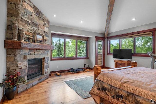 4445 N Millrace Rd, Oakley, UT 84055 - bedroom with multiple windows, a fireplace, beam ceiling, wood finished floors, and recessed lighting