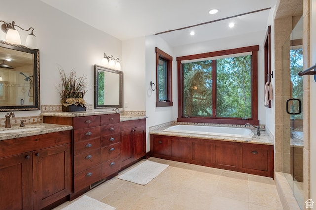 4445 N Millrace Rd, Oakley, UT 84055 - bathroom featuring a shower stall, a bath, vanity, and recessed lighting