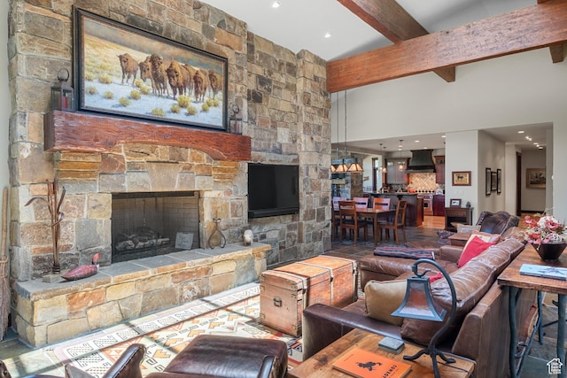 4445 N Millrace Rd, Oakley, UT 84055 - living area featuring beamed ceiling, a towering ceiling, a fireplace, and recessed lighting