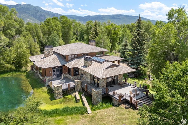 4445 N Millrace Rd, Oakley, UT 84055 - aerial view of property and surrounding area featuring a forest and a mountainous background