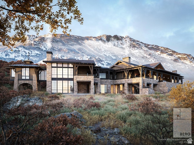 8988 N Sleeping Rock Cir, Kamas, UT 84036 - back of house featuring stone siding, a chimney, and a mountain view