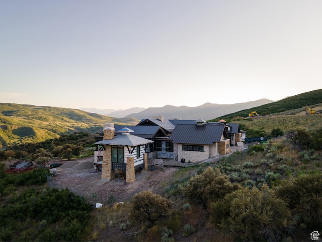 8988 N Sleeping Rock Cir, Kamas, UT 84036 - back of house featuring a mountain view, a chimney, a metal roof, and a standing seam roof