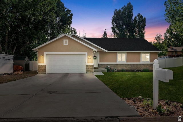 1235 N Valley Hills Blvd, Heber City, UT 84032 - ranch-style home featuring concrete driveway, brick siding, an attached garage, and stucco siding