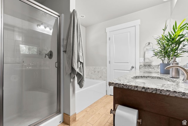 1235 N Valley Hills Blvd, Heber City, UT 84032 - full bath featuring a stall shower, vanity, a garden tub, and wood finished floors