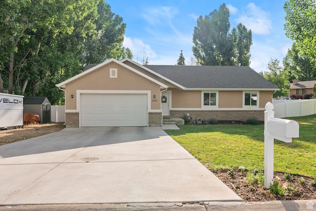 1235 N Valley Hills Blvd, Heber City, UT 84032 - ranch-style home featuring brick siding, driveway, stucco siding, an attached garage, and a storage unit