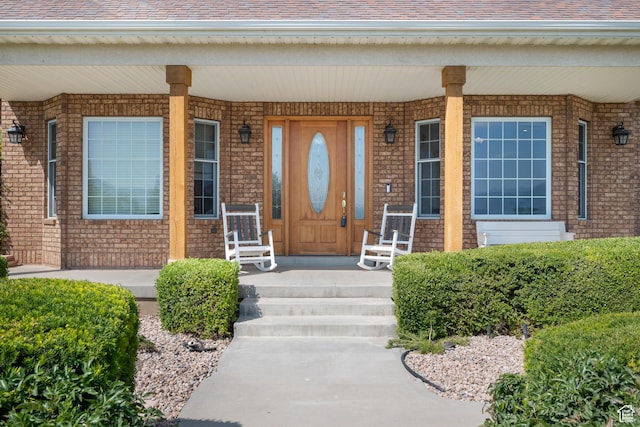 11508 S 5825 W, Payson, UT 84651 - property entrance featuring a porch, brick siding, and roof with shingles