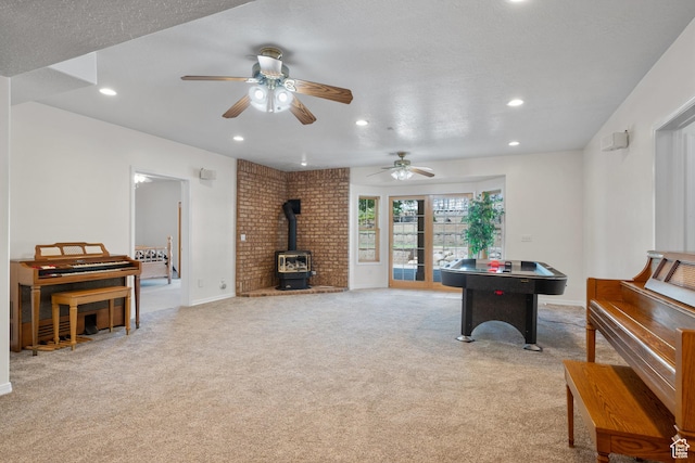 11508 S 5825 W, Payson, UT 84651 - game room with a wood stove, recessed lighting, light colored carpet, and ceiling fan