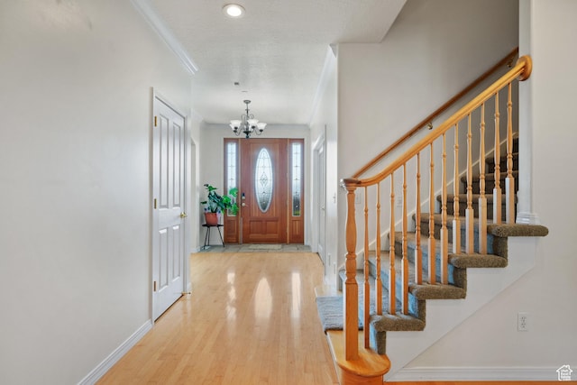 11508 S 5825 W, Payson, UT 84651 - entrance foyer with a chandelier, wood finished floors, crown molding, and stairs