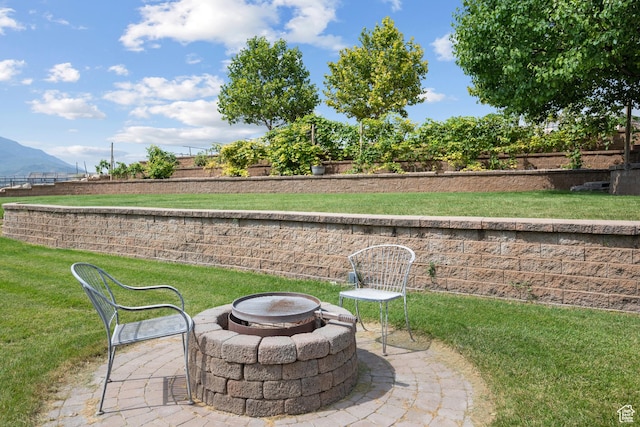 11508 S 5825 W, Payson, UT 84651 - view of green lawn featuring a fire pit, a mountain view, and a patio