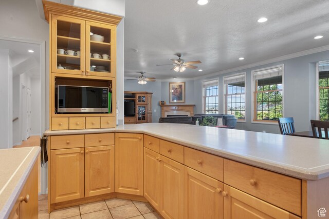 11508 S 5825 W, Payson, UT 84651 - kitchen featuring light countertops, recessed lighting, ornamental molding, glass insert cabinets, and light brown cabinets