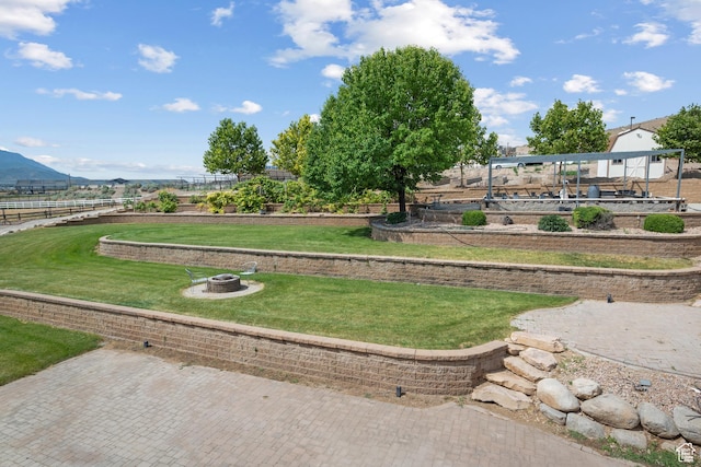 11508 S 5825 W, Payson, UT 84651 - view of property's community with an outdoor fire pit, a lawn, and a mountain view