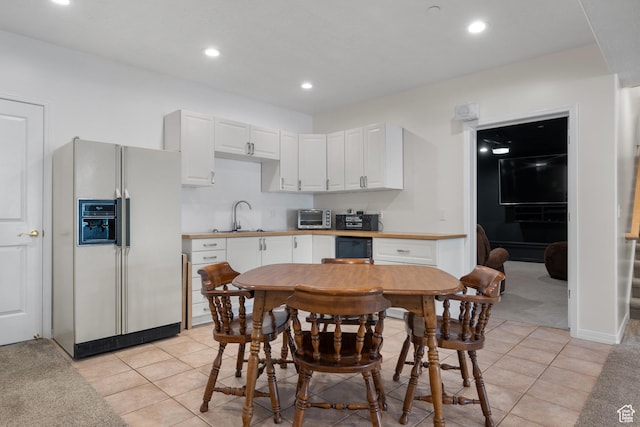 11508 S 5825 W, Payson, UT 84651 - kitchen featuring white fridge with ice dispenser, white cabinetry, recessed lighting, light tile patterned floors, and light countertops