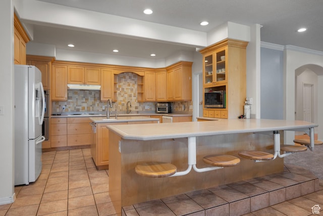 11508 S 5825 W, Payson, UT 84651 - kitchen with freestanding refrigerator, under cabinet range hood, a peninsula, stainless steel microwave, and light countertops